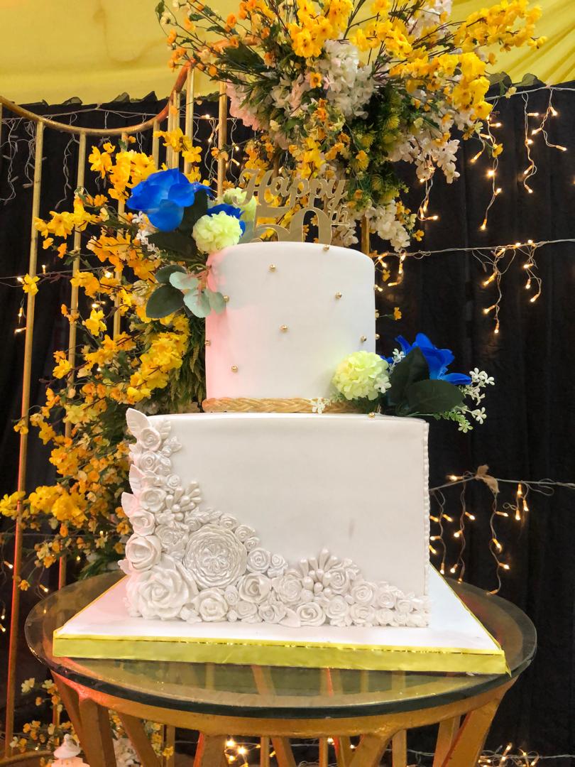Custom celebration cake with elegant frosting design